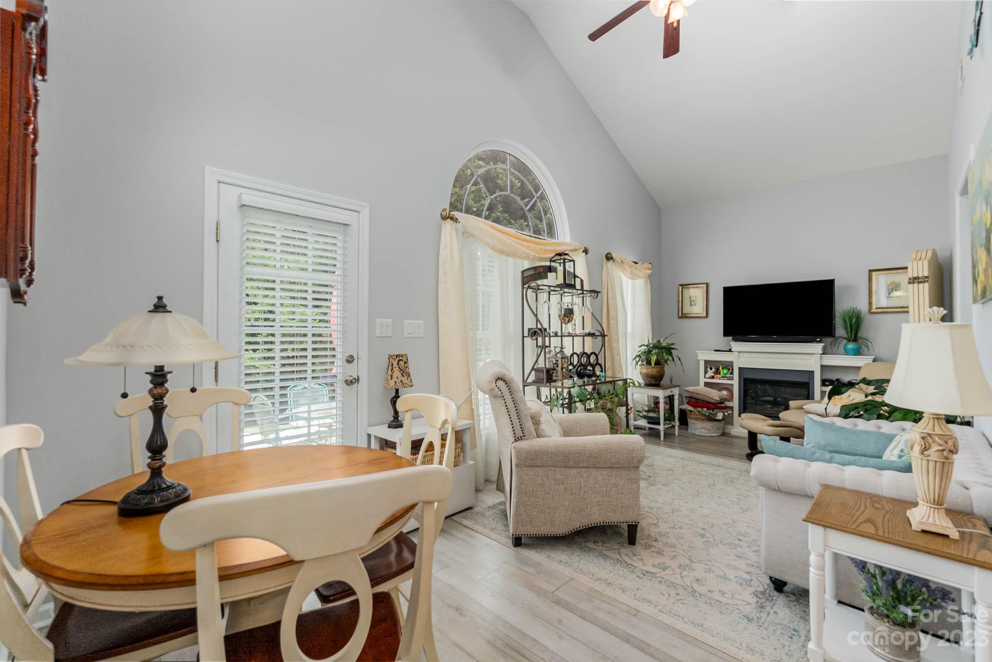 112 Pine Lake Drive Monroe, NC 28110 - Photo 17 of 37 a living room with furniture and a flat screen tv