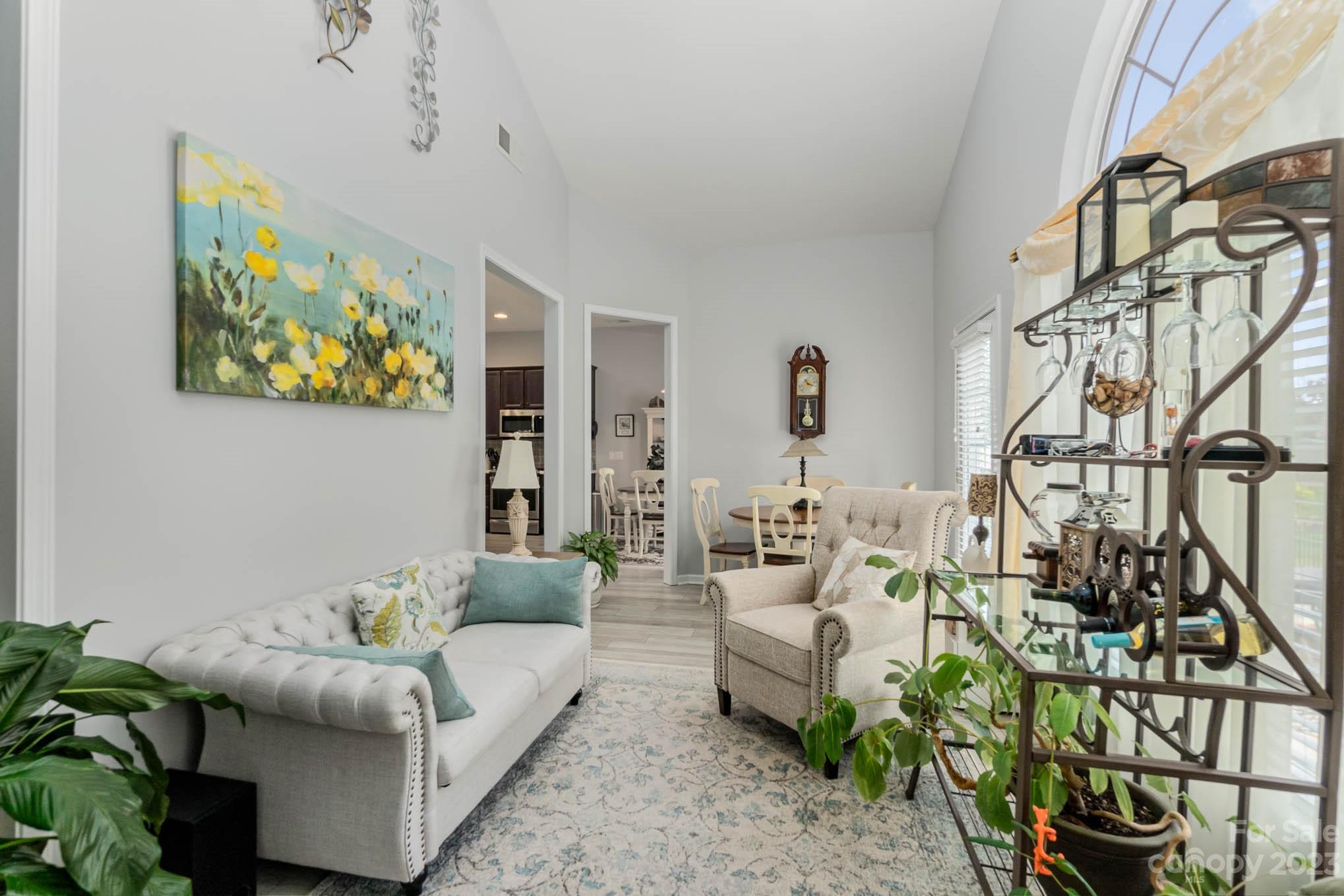 112 Pine Lake Drive Monroe, NC 28110 - Photo 18 of 37 a living room with furniture and a painting on the wall