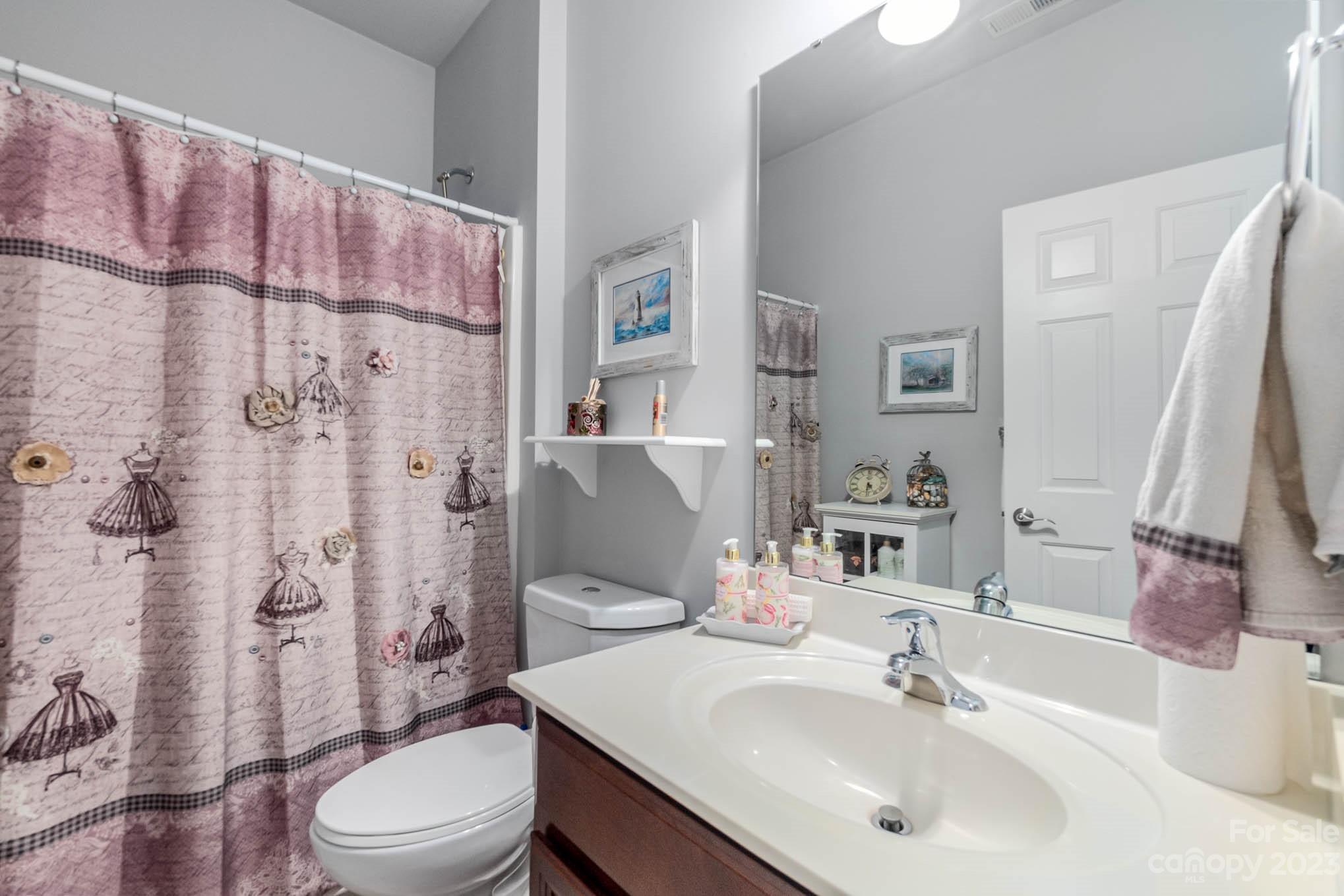 112 Pine Lake Drive Monroe, NC 28110 - Photo 28 of 37 a bathroom with a sink toilet and shower