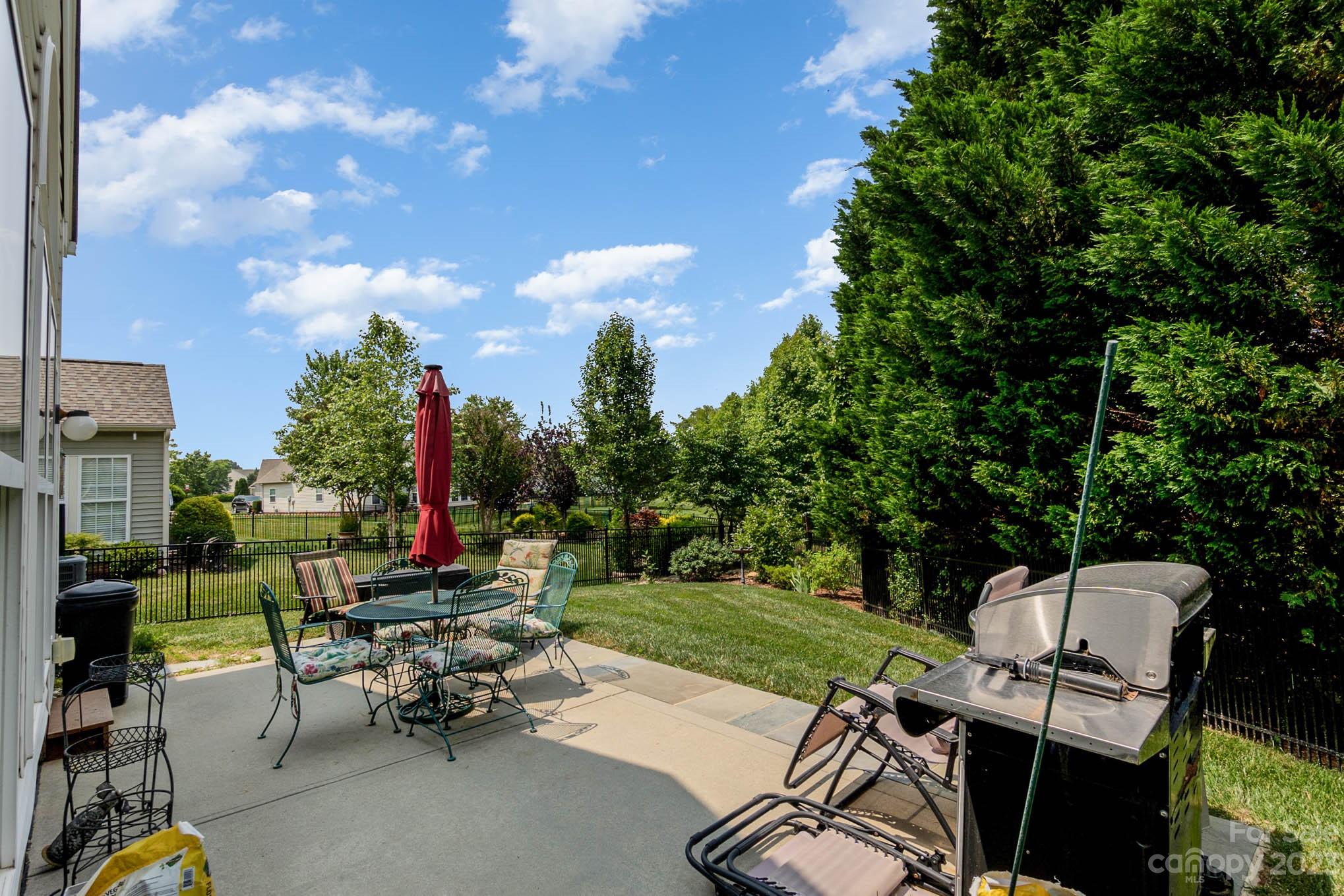 112 Pine Lake Drive Monroe, NC 28110 - Photo 35 of 37 a view of a tables and chairs in the garden