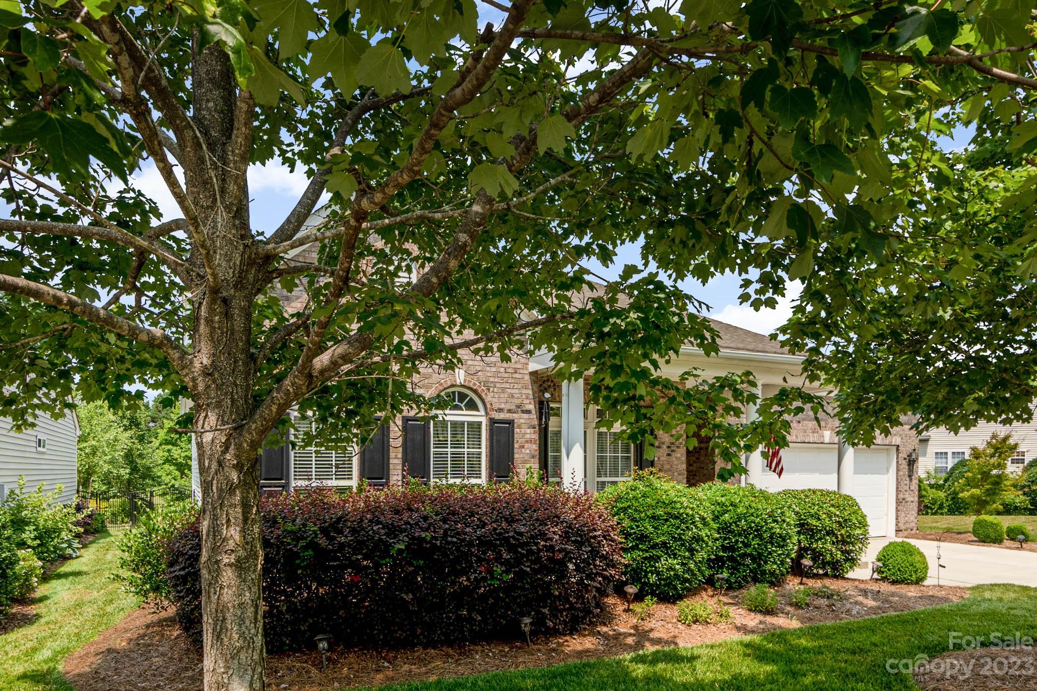 112 Pine Lake Drive Monroe, NC 28110 - Photo 5 of 37 a front view of a house with garden