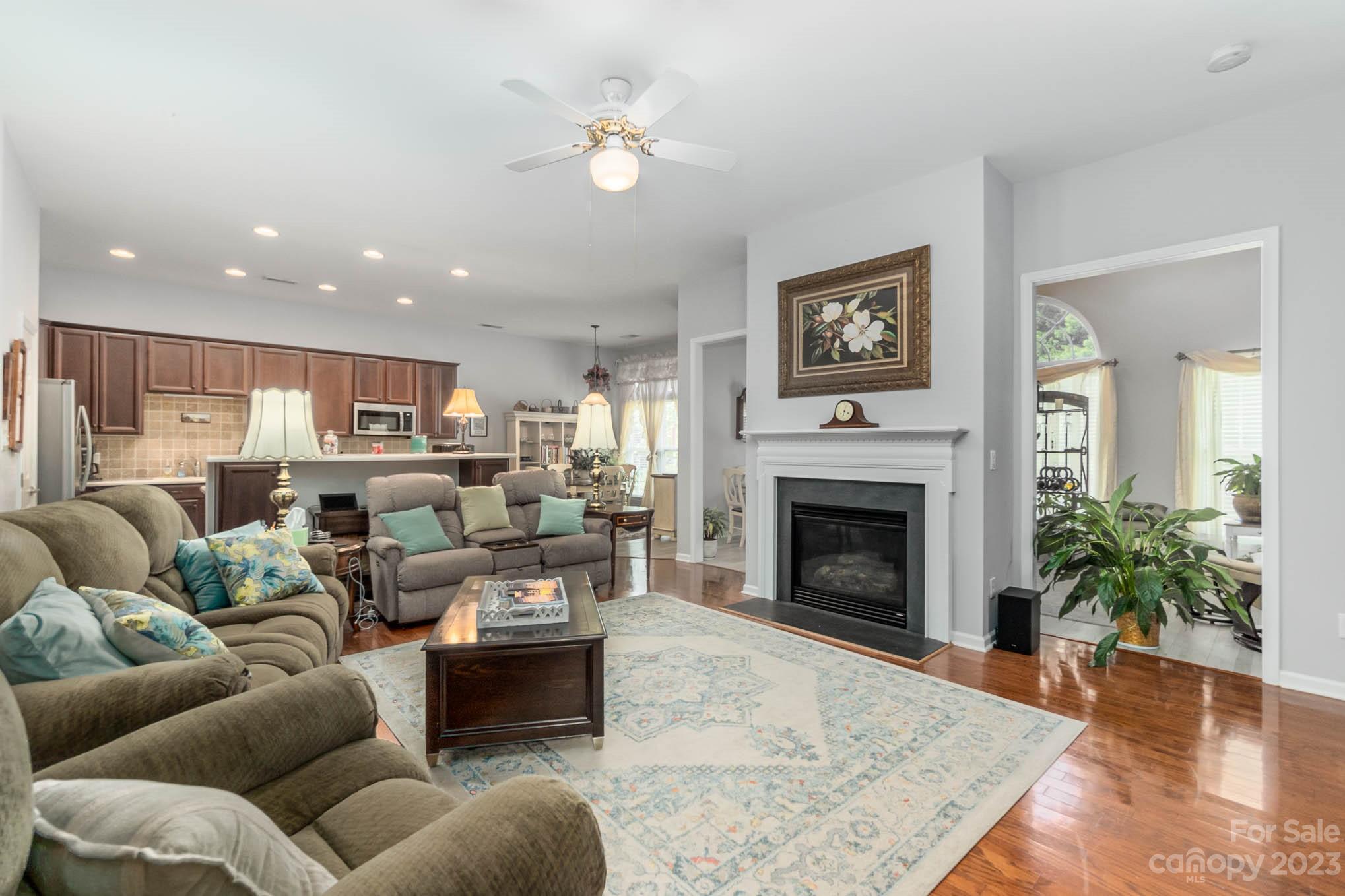 112 Pine Lake Drive Monroe, NC 28110 - Photo 10 of 37 a living room with furniture and a fireplace