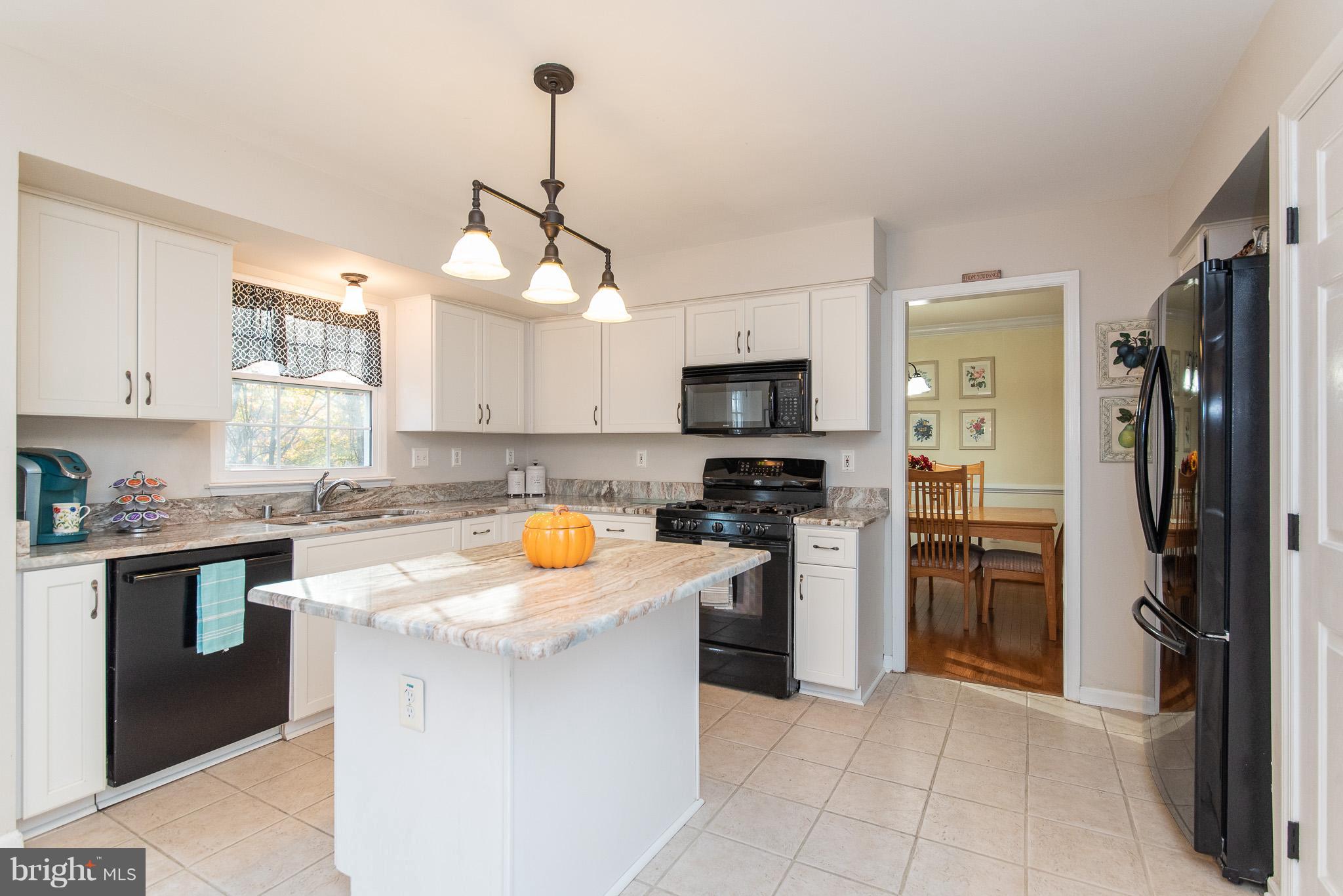 583 Henderson Road Bel Air, MD 21014 - Photo 12 of 42 a kitchen with a refrigerator stove and sink