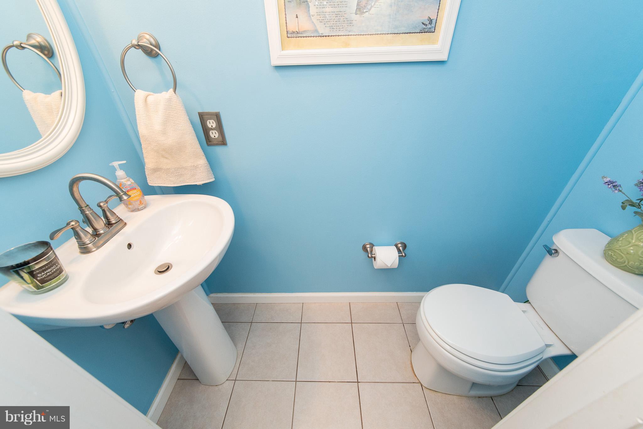 583 Henderson Road Bel Air, MD 21014 - Photo 15 of 42 a bathroom with a toilet sink and mirror