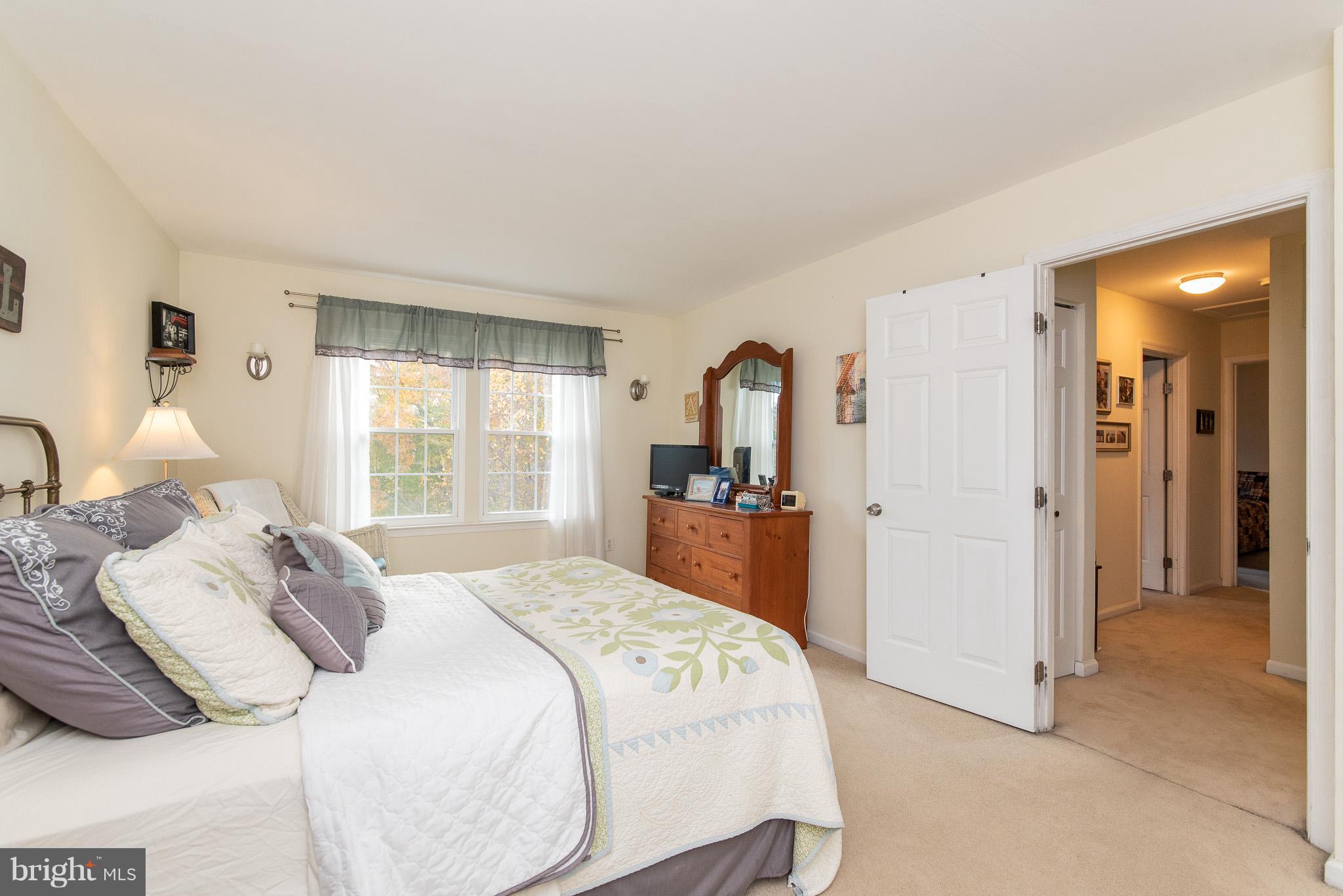 583 Henderson Road Bel Air, MD 21014 - Photo 19 of 42 a bedroom with a bed and a large mirror