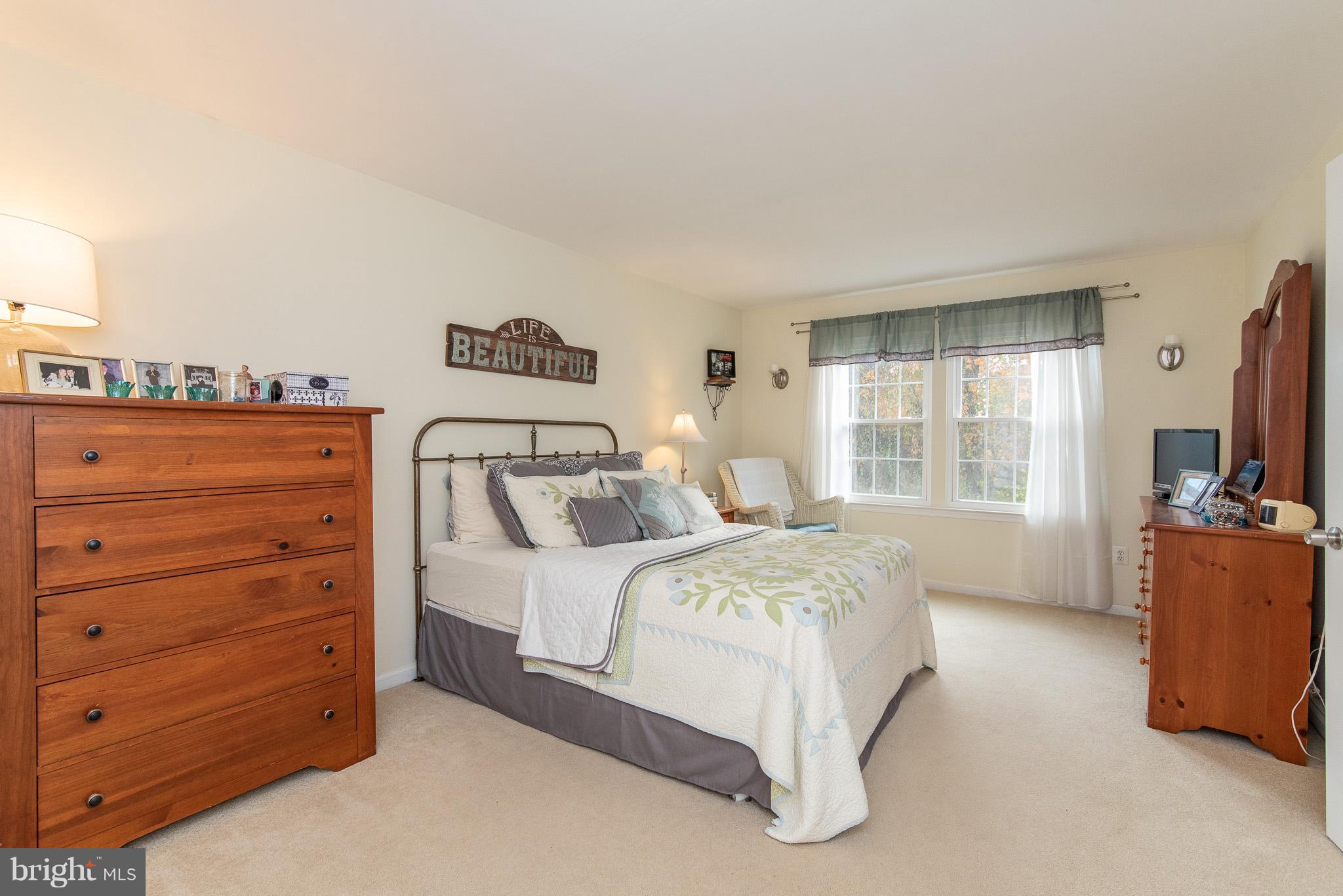 583 Henderson Road Bel Air, MD 21014 - Photo 20 of 42 a bedroom with a bed and a flat screen tv