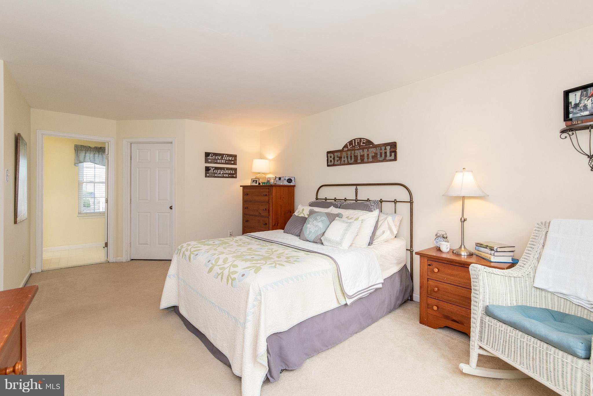 583 Henderson Road Bel Air, MD 21014 - Photo 21 of 42 a bedroom with a bed and a lamp