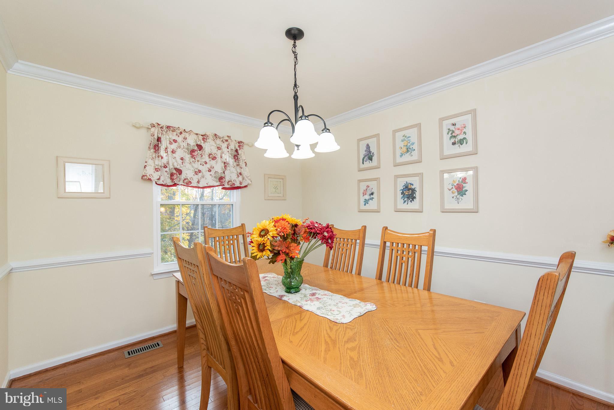 583 Henderson Road Bel Air, MD 21014 - Photo 6 of 42 a view of a dining room with furniture wooden floor and a chandelier