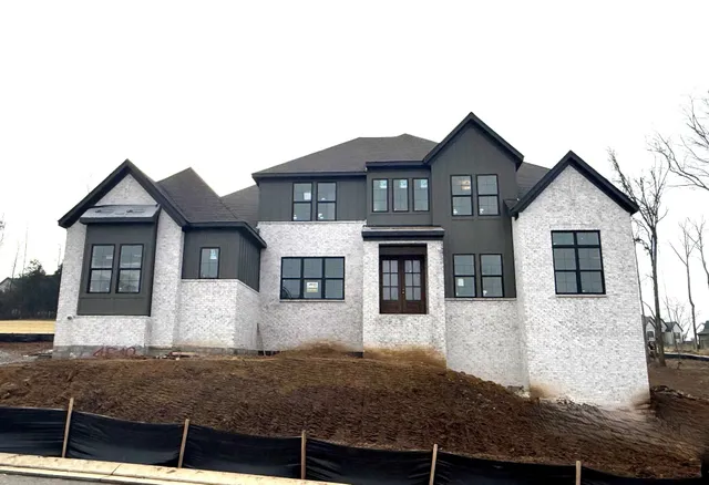a front view of a house with garage