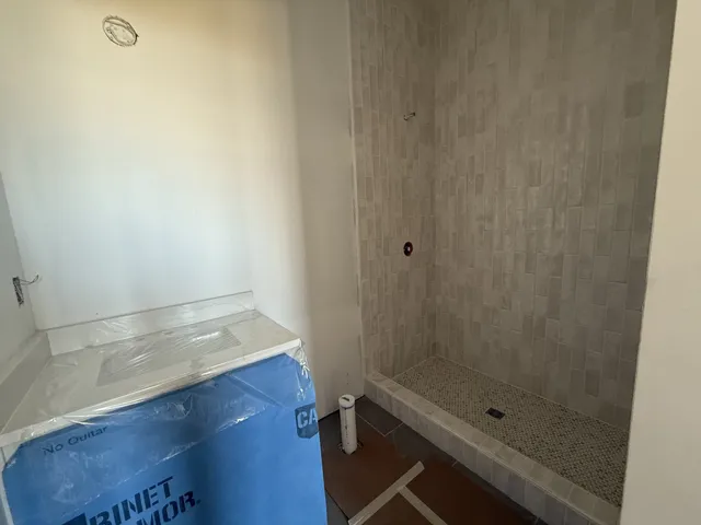 a view of a storage & utility room with flat screen tv