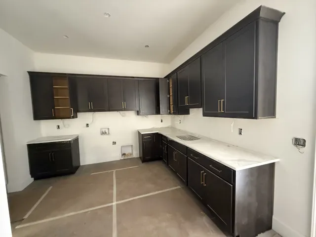 a room with painting on the wall and a shower