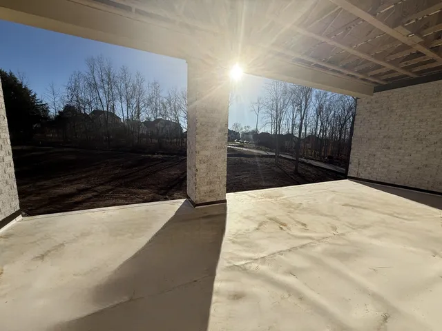 a view of street with wooden fence