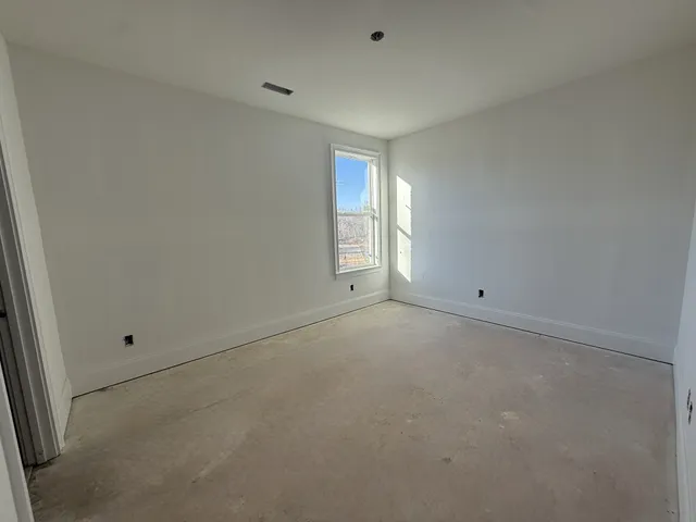 a view of a street with plants