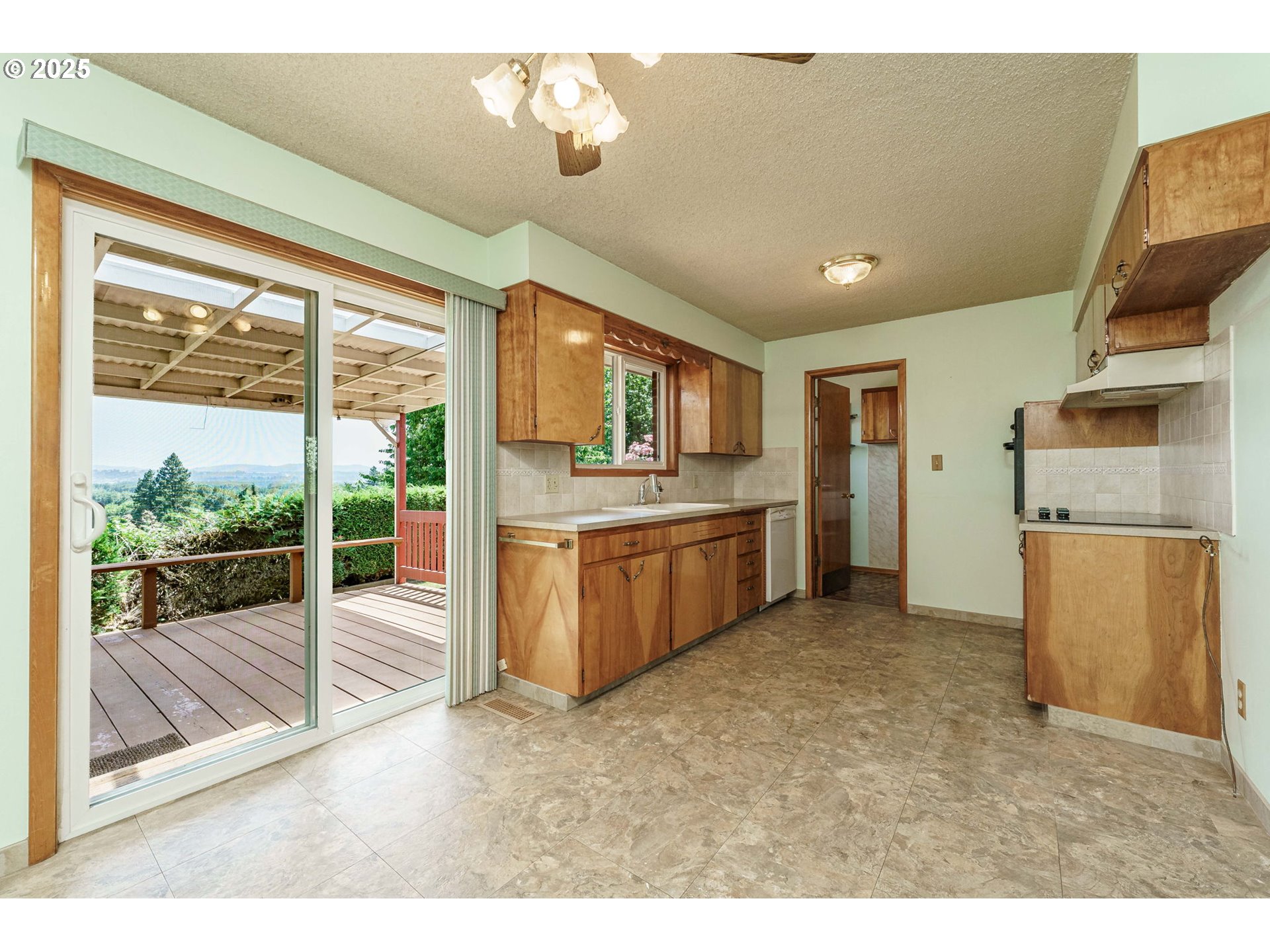 1938 Northwest Sierra Lane Camas, WA 98607 - Photo 11 of 33 a open kitchen with a sink refrigerator and cabinets