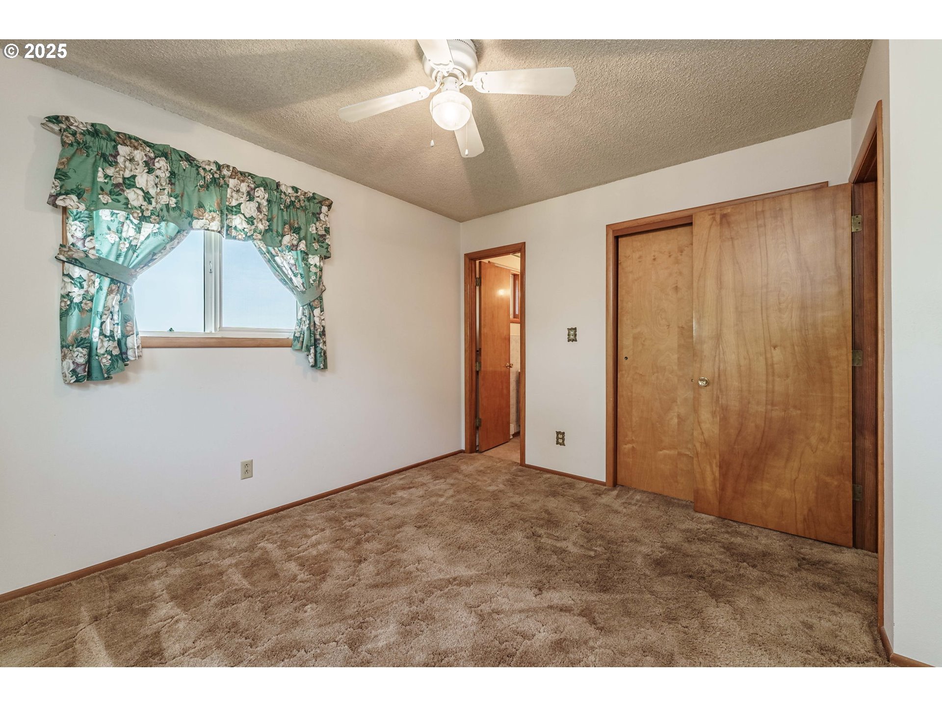 1938 Northwest Sierra Lane Camas, WA 98607 - Photo 12 of 33 a view of an empty room with a window