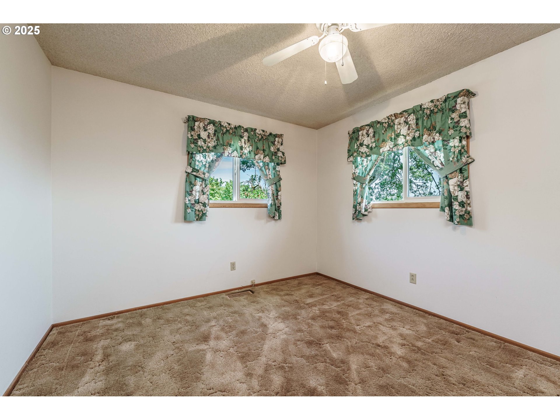 1938 Northwest Sierra Lane Camas, WA 98607 - Photo 14 of 33 a view of an empty room with windows