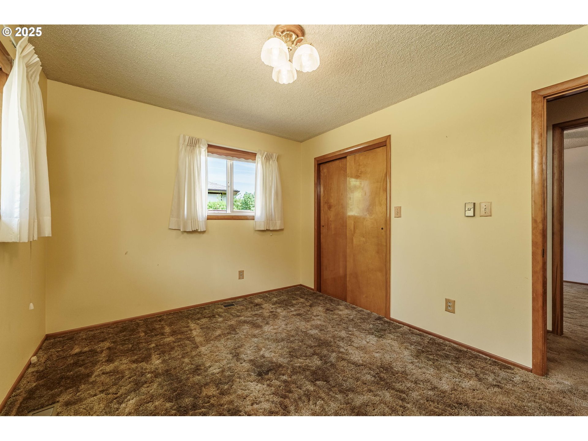 1938 Northwest Sierra Lane Camas, WA 98607 - Photo 19 of 33 a view of an empty room with a window