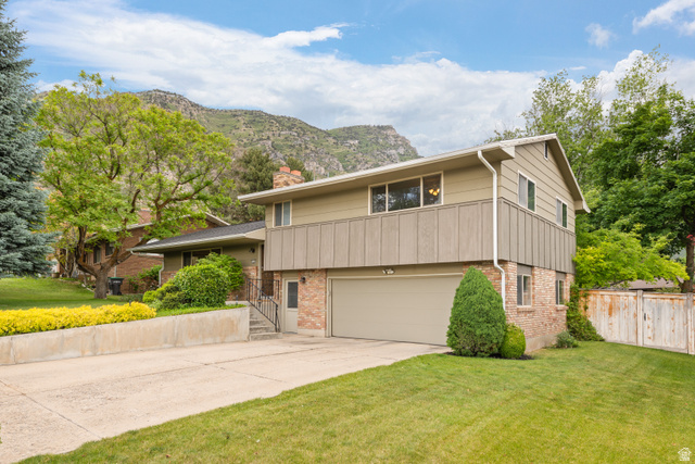 3320 Cherokee Lane Provo, UT 84604 - Photo 3 of 52 Split-level residence featuring a brick and wood-siding exterior
