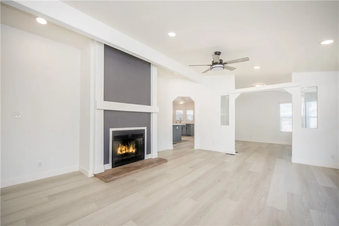 1051 Site, Unit 31 Brea, CA 92821 - Photo 12 of 35 a view of a livingroom with a fireplace and a chandelier fan