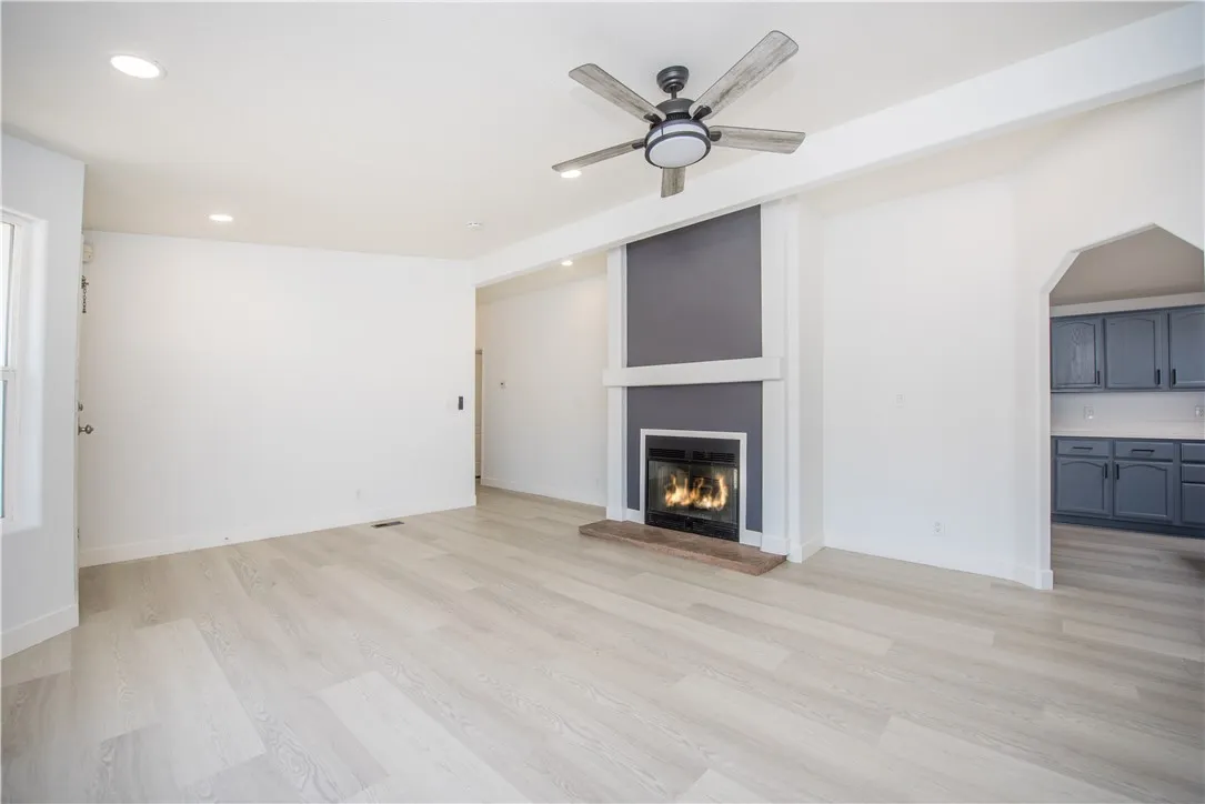 1051 Site, Unit 31 Brea, CA 92821 - Photo 13 of 35 a view of an empty room with a fireplace and a window