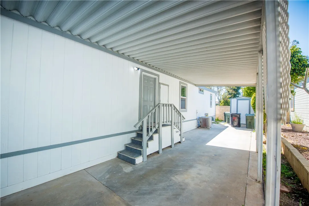 1051 Site, Unit 31 Brea, CA 92821 - Photo 2 of 35 a view of a hallway with a livingroom with furniture