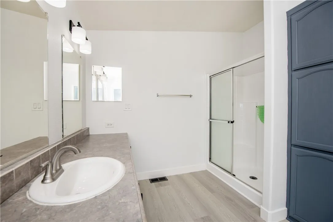 1051 Site, Unit 31 Brea, CA 92821 - Photo 22 of 35 a bathroom with a sink and a mirror