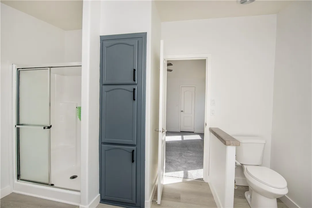 1051 Site, Unit 31 Brea, CA 92821 - Photo 23 of 35 a bathroom with a glass door shower