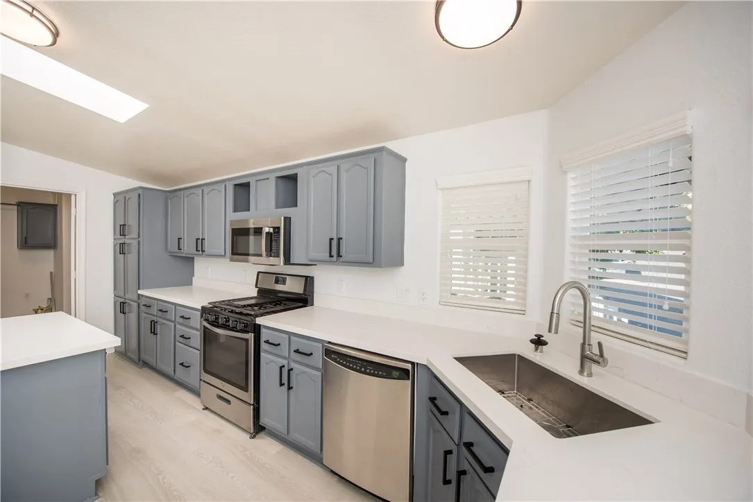 1051 Site, Unit 31 Brea, CA 92821 - Photo 3 of 35 a kitchen with stainless steel appliances granite countertop a sink stove and refrigerator