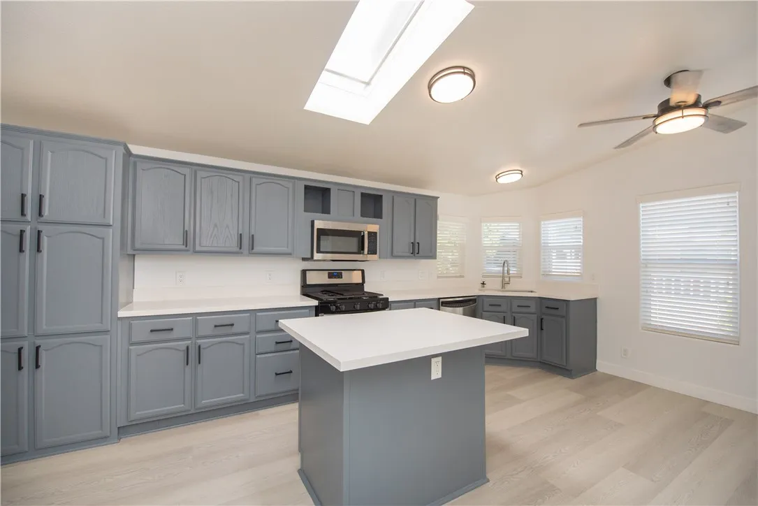 1051 Site, Unit 31 Brea, CA 92821 - Photo 5 of 35 a kitchen with a sink a counter top space and appliances