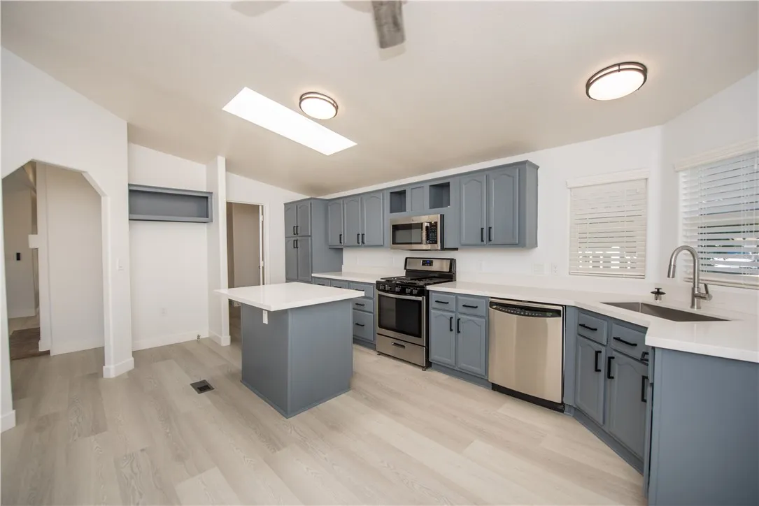 1051 Site, Unit 31 Brea, CA 92821 - Photo 7 of 35 a kitchen with a sink stove and refrigerator