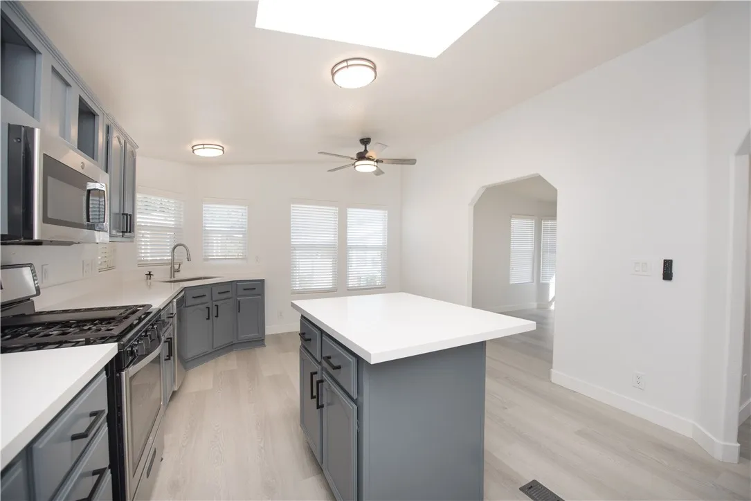 1051 Site, Unit 31 Brea, CA 92821 - Photo 8 of 35 a kitchen with a sink stove and cabinets