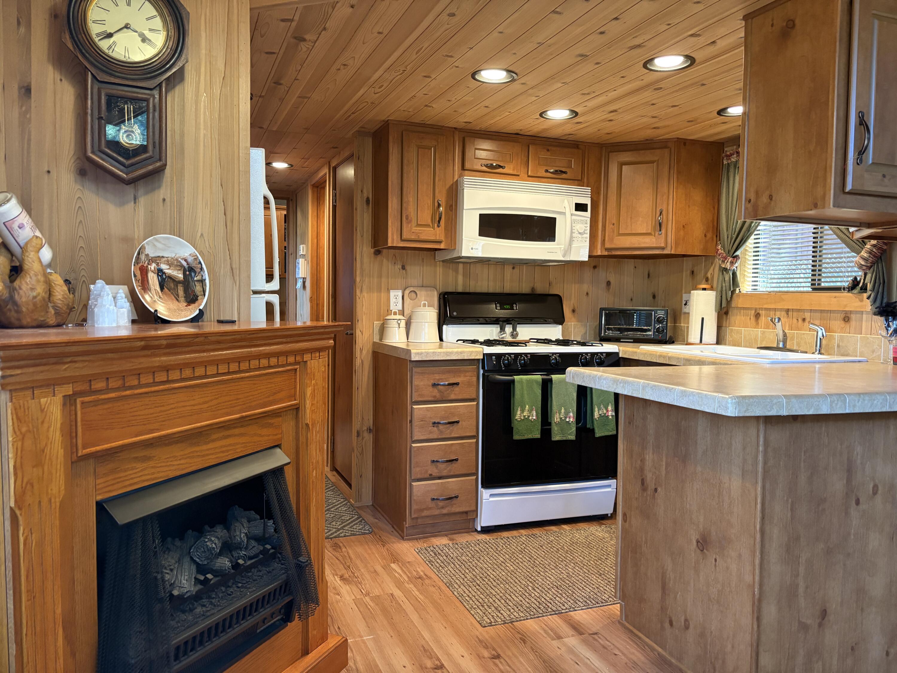 52901 Pine Cove Road, Unit 42 Idyllwild, CA 92549 - Photo 4 of 28 Fireplace and Kitchen