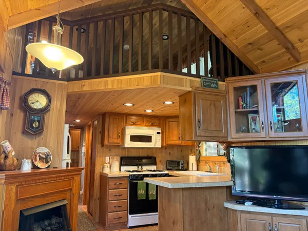 a view of a kitchen with a sink and a stove