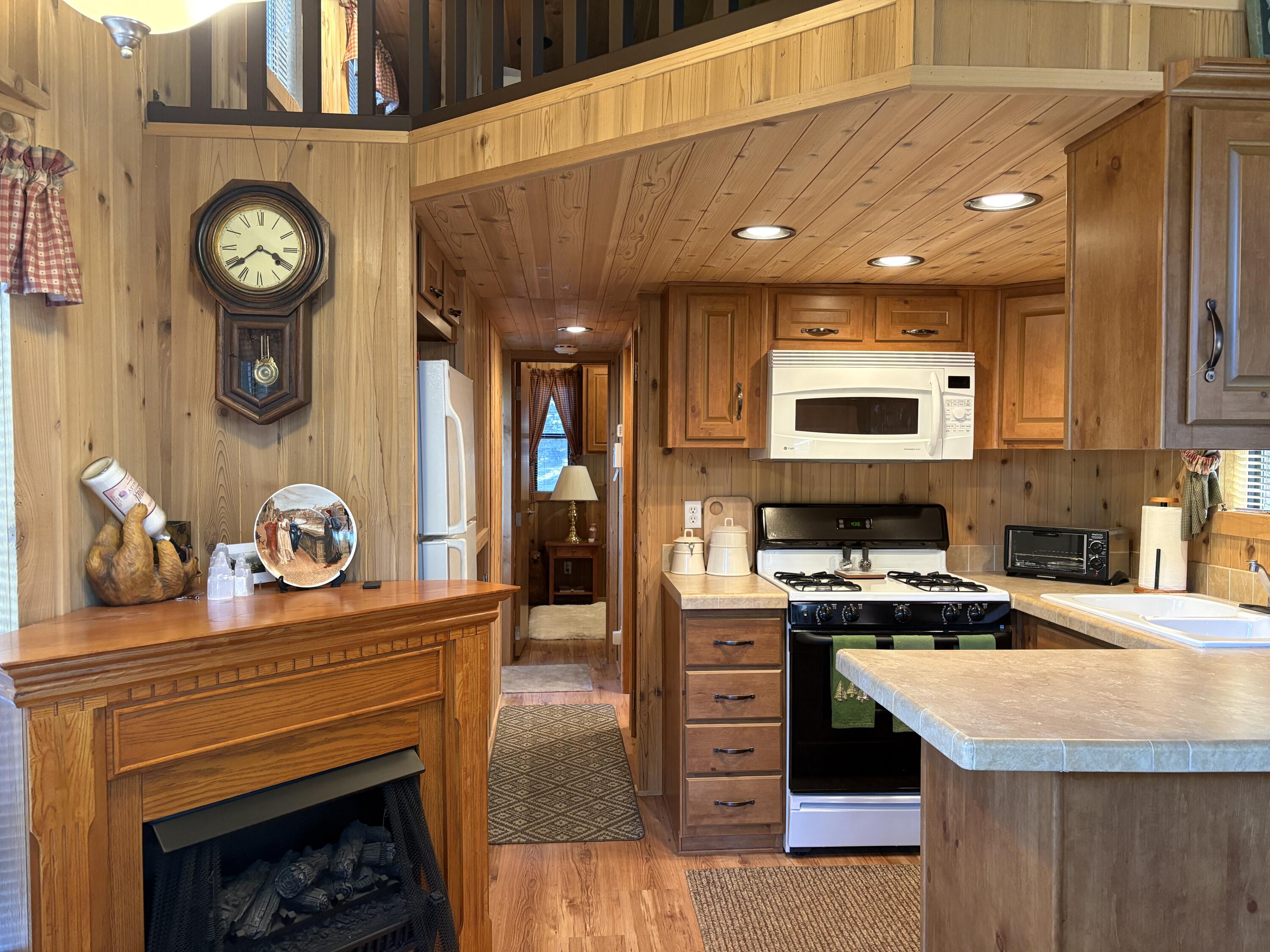 52901 Pine Cove Road, Unit 42 Idyllwild, CA 92549 - Photo 8 of 28 Fireplace and Kitchen