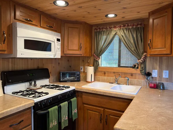 a kitchen with a stove and a sink