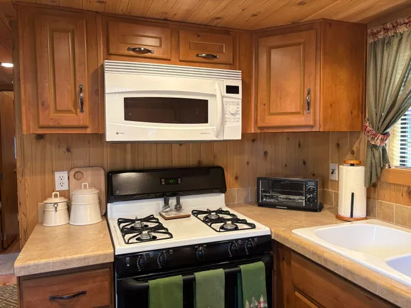 a kitchen with a stove and a microwave