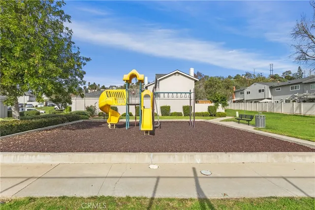 a view of a swimming pool with a lawn chairs