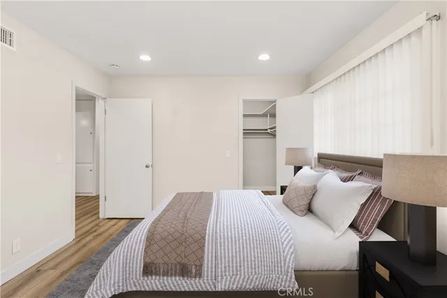 a bedroom with a bed and a couch