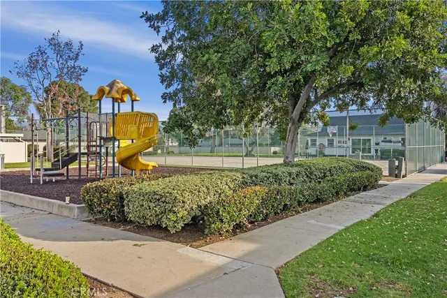 a view of a park with swings and slides