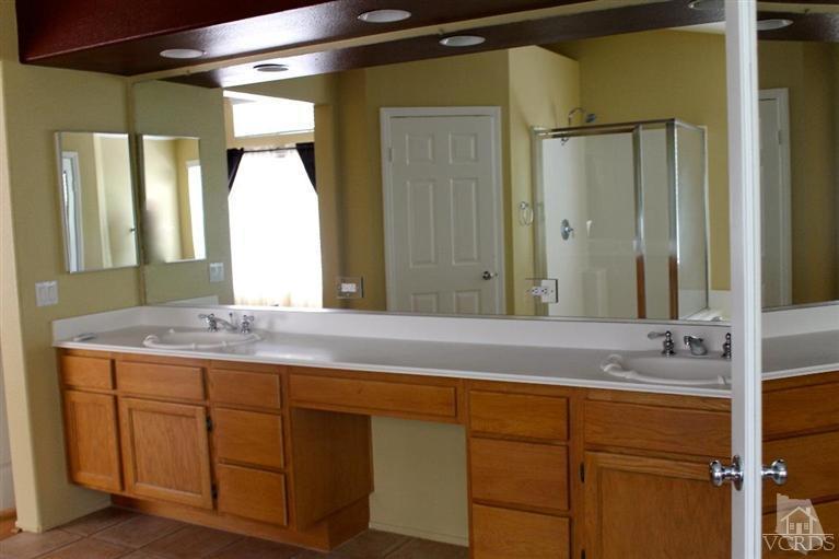 1094 Waltham Road Simi Valley, CA 93065 - Photo 14 of 25 a bathroom with a granite countertop sink mirror and double