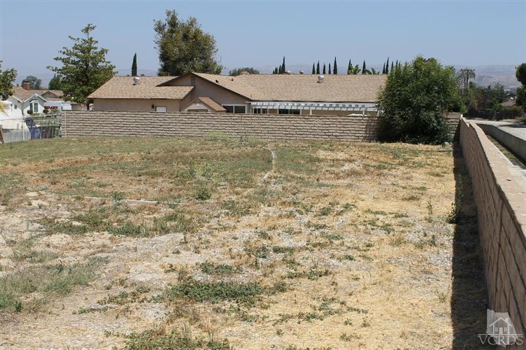 1094 Waltham Road Simi Valley, CA 93065 - Photo 22 of 25 a view of a house with a yard and a pond