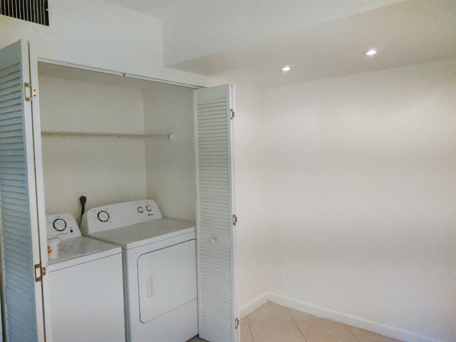 6341 Chasewood Drive, Unit B Jupiter, FL 33458 - Photo 12 of 14 a utility room with dryer and washer