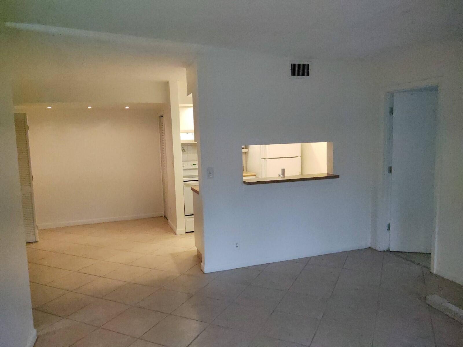 6341 Chasewood Drive, Unit B Jupiter, FL 33458 - Photo 6 of 14 an empty room with a window