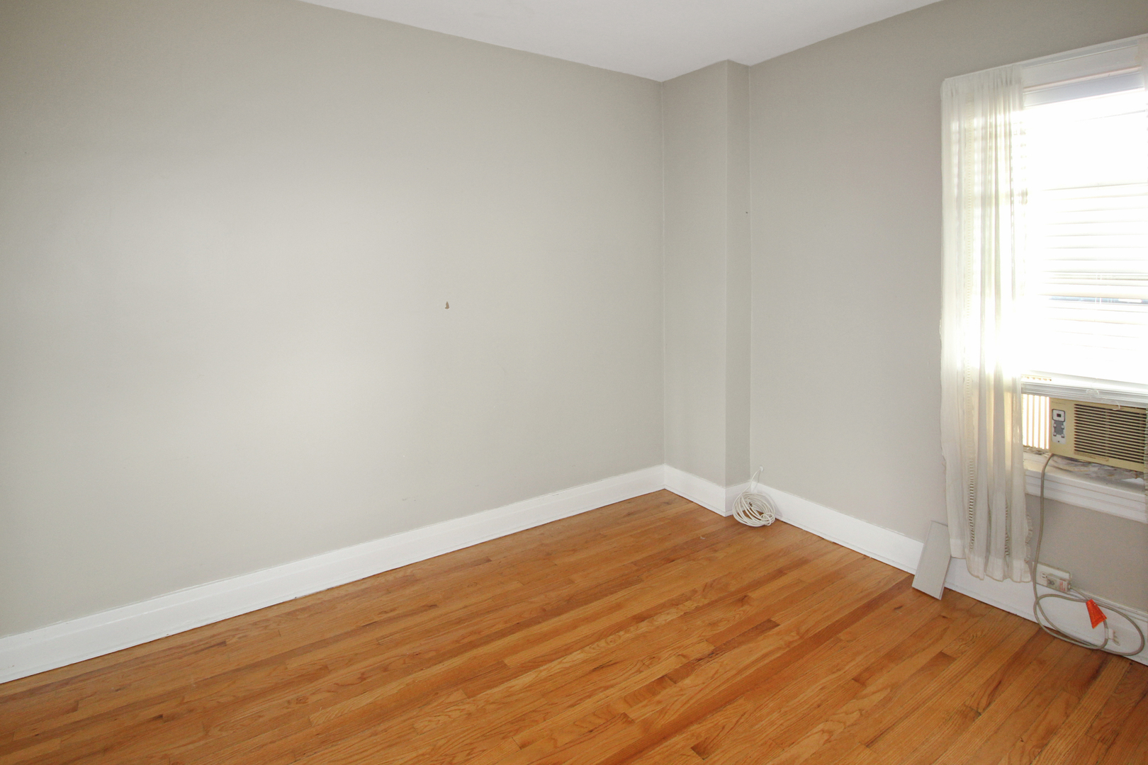 125 North Addison Avenue, Unit 3 Elmhurst, IL 60126 - Photo 11 of 16 a view of empty room with wooden floor
