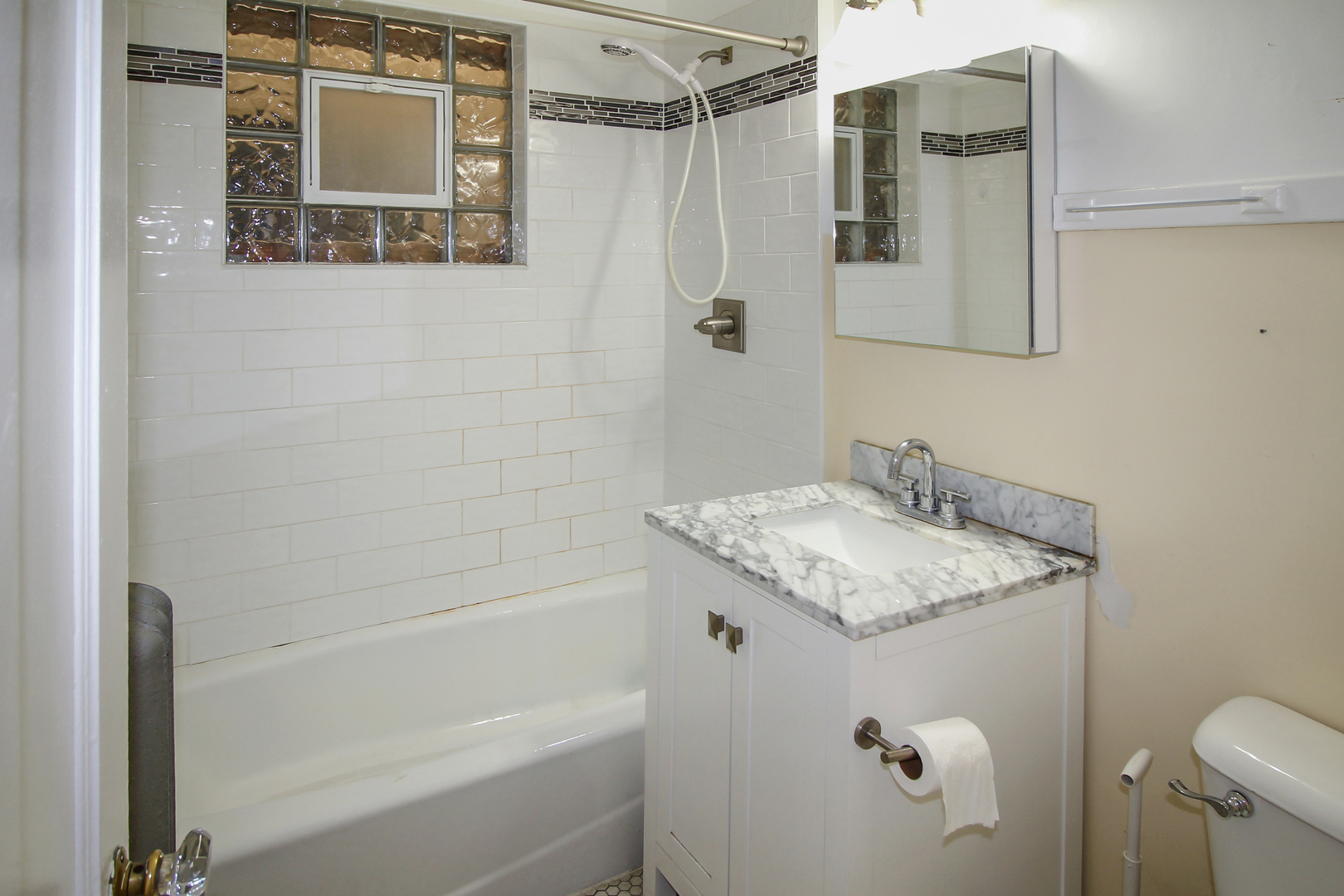 125 North Addison Avenue, Unit 3 Elmhurst, IL 60126 - Photo 10 of 16 a bathroom with a granite countertop sink toilet and shower