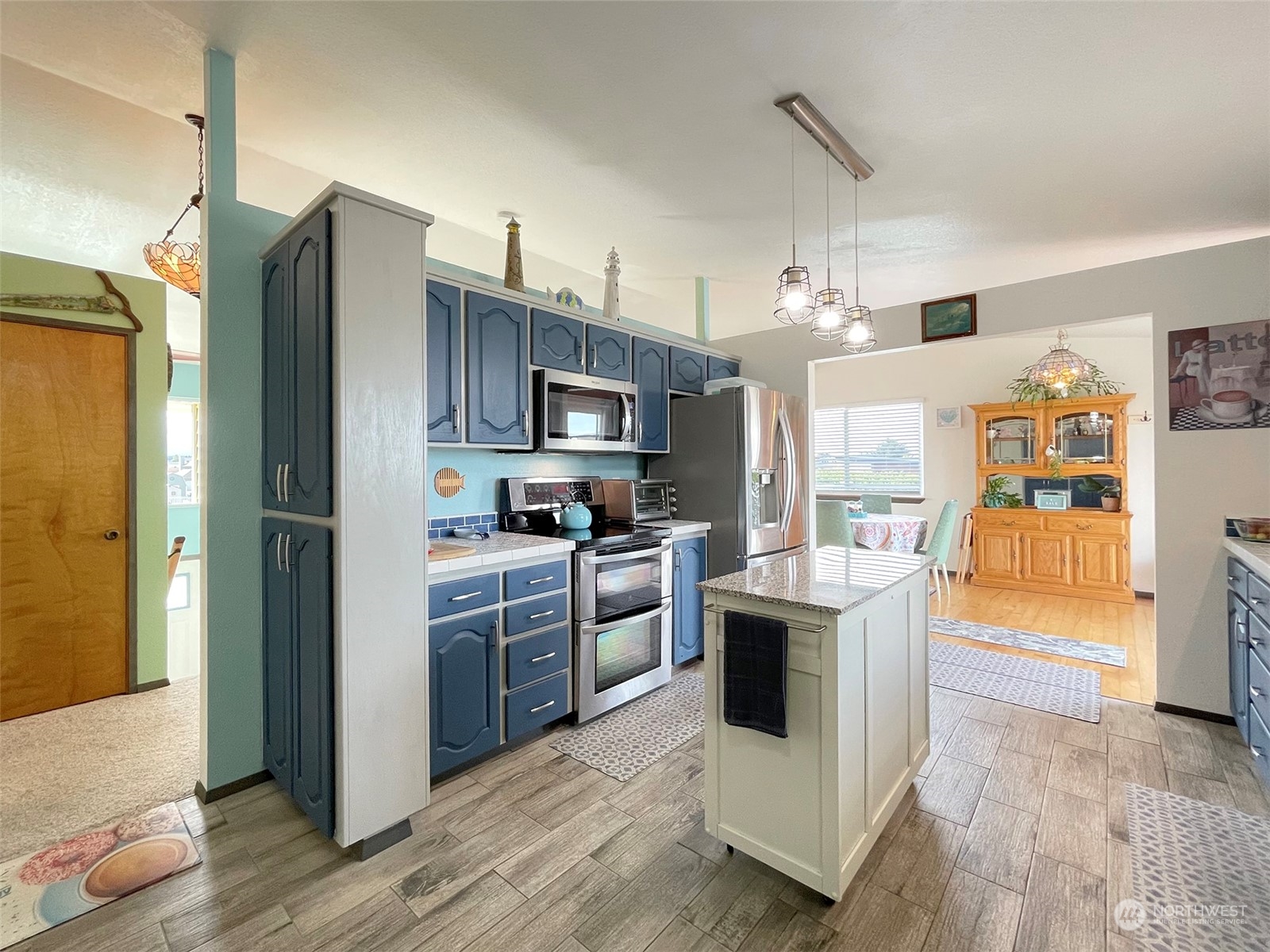 190 Greywolf Road Sequim, WA 98382 - Photo 11 of 40 a kitchen with cabinets and stainless steel appliances