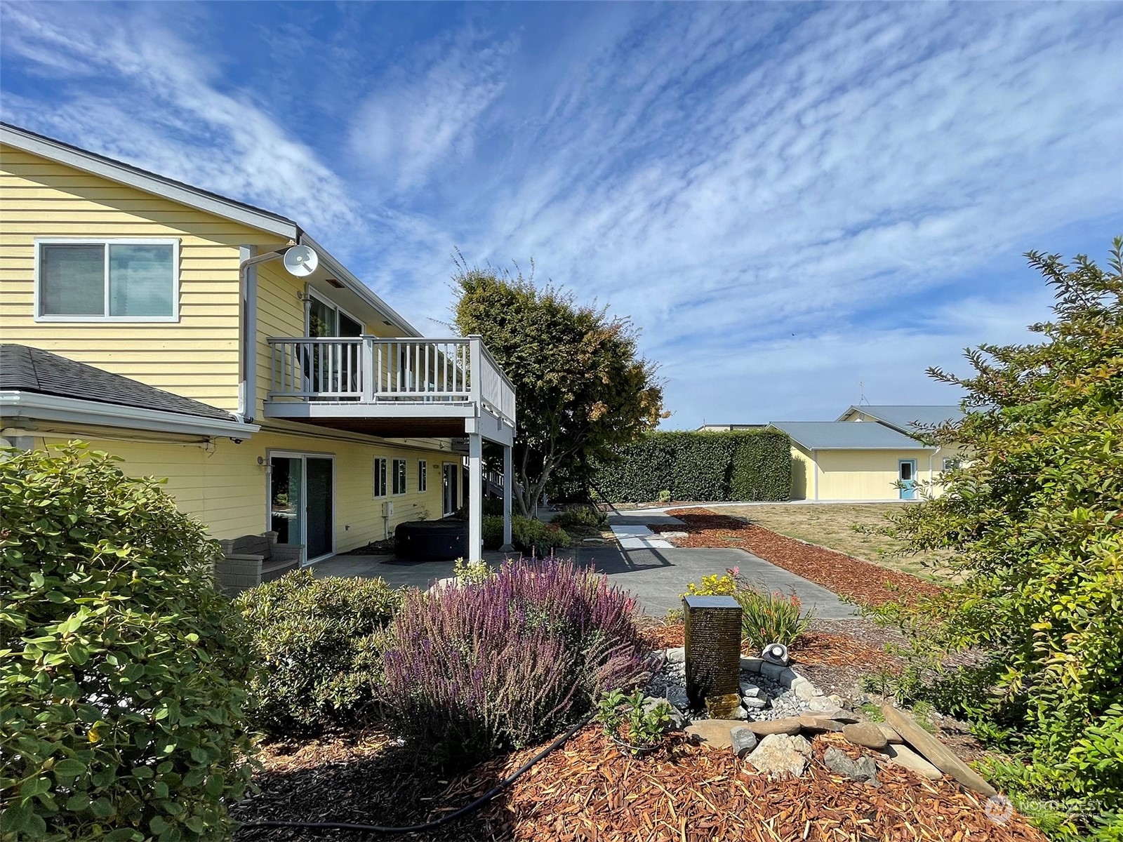 190 Greywolf Road Sequim, WA 98382 - Photo 26 of 40 a front view of a house with garden