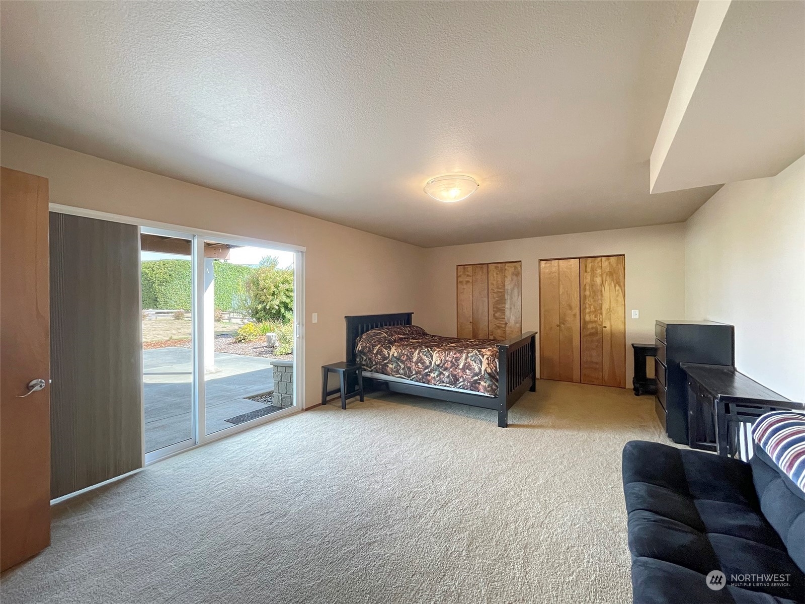 190 Greywolf Road Sequim, WA 98382 - Photo 30 of 40 a bedroom with furniture and a large window