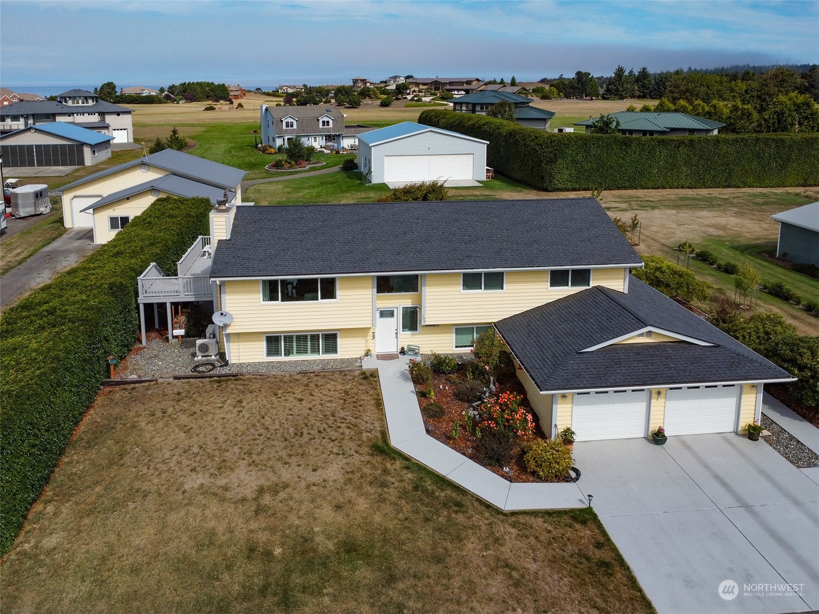 190 Greywolf Road Sequim, WA 98382 - Photo 3 of 40 an aerial view of a house with yard swimming pool and outdoor seating