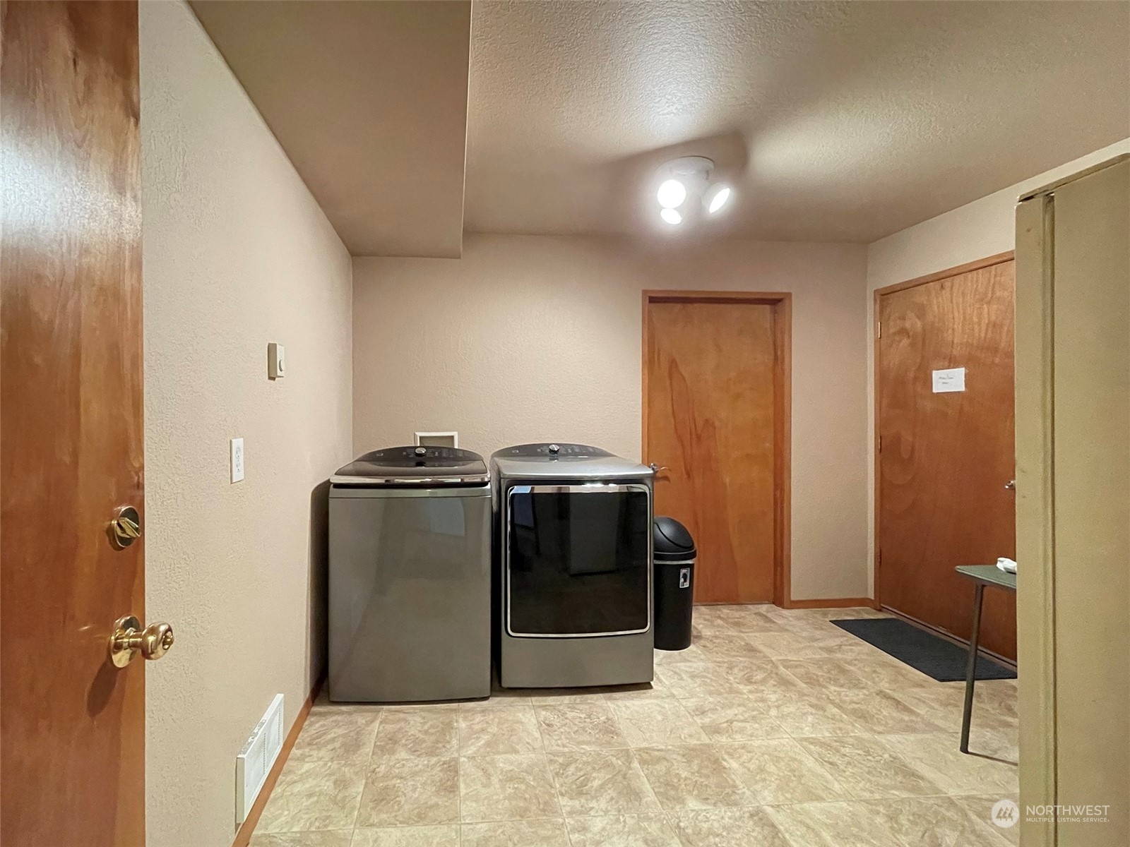 190 Greywolf Road Sequim, WA 98382 - Photo 33 of 40 a view of a kitchen with stainless steel appliances granite countertop a refrigerator and a sink